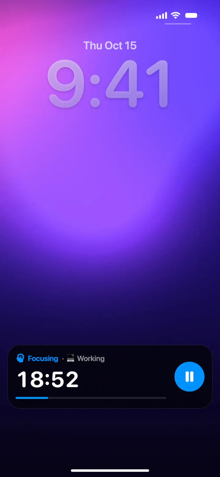 The iPhone Lock Screen with the Pomodoro Focus Live Activity: Focusing, Working, 18:52 and a pause button